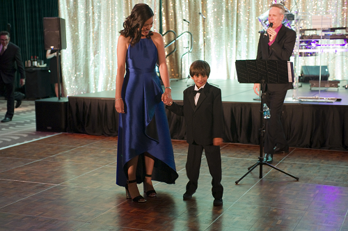 woman and child leaving the stage