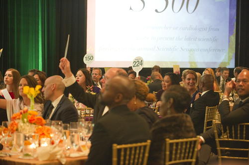 guests bidding for auction item